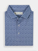 Blue patterned shirt with intricate vine swirling design, folded neatly. It has a pointed collar and three white buttons. Label visible inside the collar.
