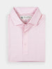 Folded light pink polo shirt with subtle white squiggly vine pattern on white background