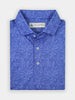 Blue floral-patterned polo shirt, folded neatly. The design features intricate flower motifs. The shirt has a classic collar and white buttons, conveying elegance.