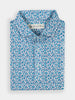 Folded whispy floral blue and white shirt with a three-button placket. The small floral pattern gives a fresh, vibrant feel. Label inside the collar.