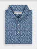 Navy blue floral-patterned polo shirt by Donald Ross, neatly folded, with a printed design