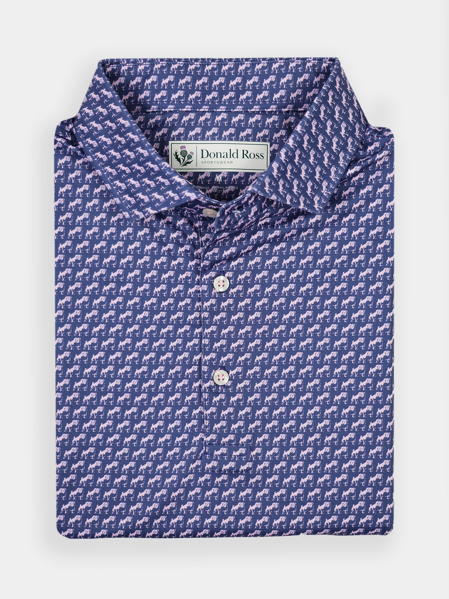 Folded blue polo shirt with a playful bulldog print pattern and a collar