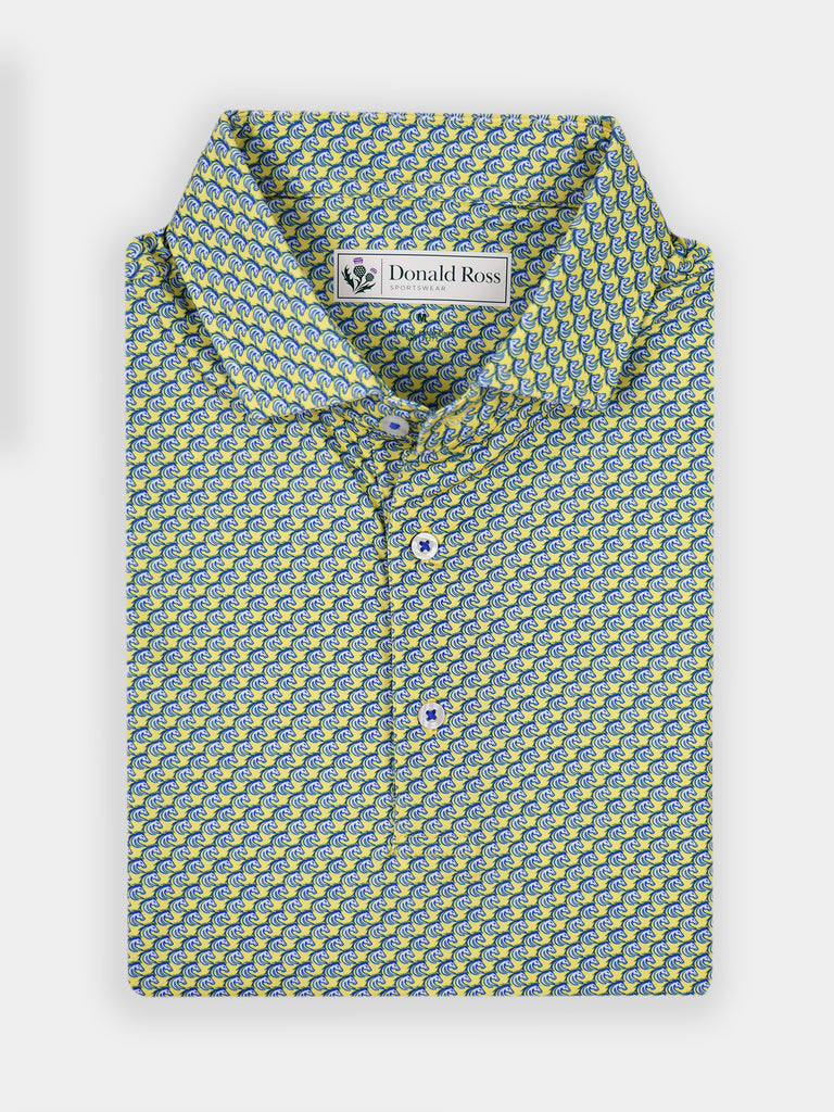 Folded short-sleeve shirt with a vibrant yellow and blue stallio print pattern