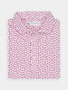 Folded shirt with a white background features a vibrant pink floral pattern. The collar is neatly arranged, conveying a fresh, lively tone.