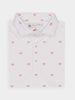 White polo shirt with a pattern of small, pink Donald Ross logos. It features a folded collar, buttoned placket, and a label reading "Donald Ross."