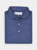 Folded navy blue polo shirt with a subtle white geometric pattern, featuring a pointed collar and three white buttons