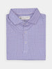 Folded purple polo shirt with a small geometric pattern, featuring a classic collar and three buttons