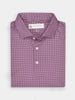 Folded maroon shirt with a small geometric pattern, featuring a button-down collar and white buttons, conveying a sophisticated and polished look.