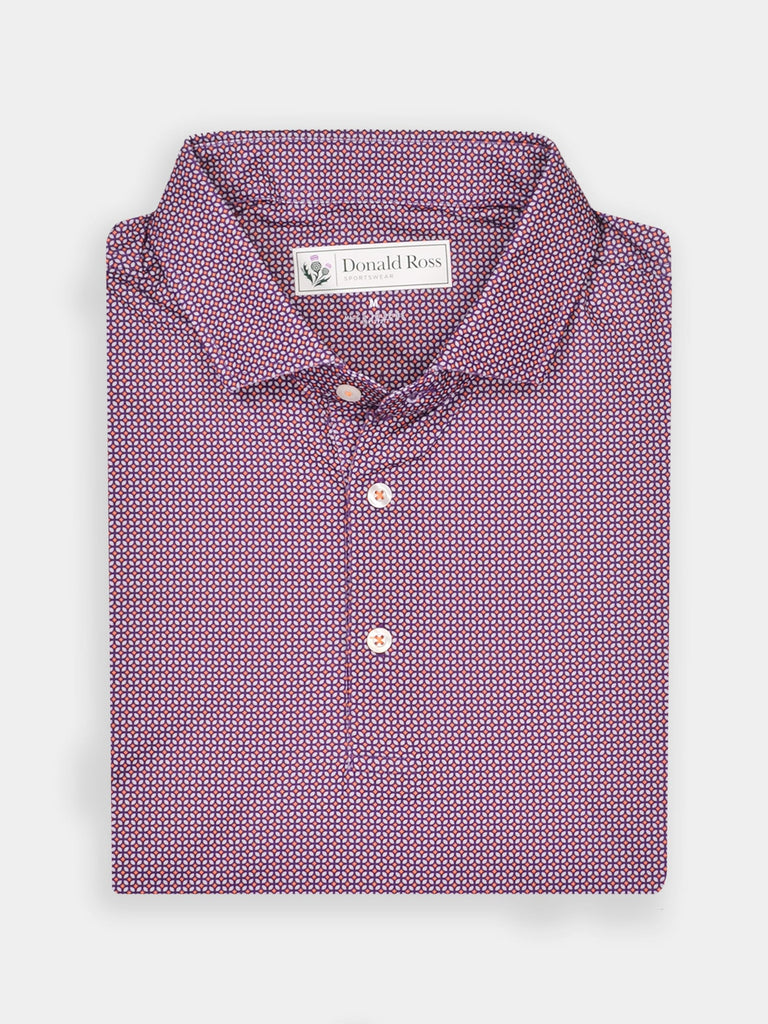 Folded maroon shirt with a small geometric pattern, featuring a button-down collar and white buttons, conveying a sophisticated and polished look.