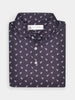 Folded black polo shirt with dodo pattern and white buttons, displayed against a plain background