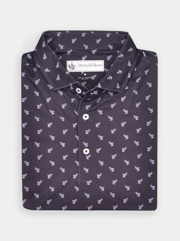 Folded black polo shirt with dodo pattern and white buttons, displayed against a plain background