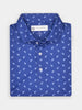 Blue polo shirt with small white dodo pattern, folded neatly. The shirt features a button-up collar and a visible label