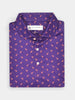 Folded purple polo shirt with a small orange dodo pattern, featuring a three-button placket. The fabric tag is visible under the collar, adding a stylish detail.