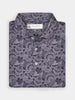 Folded dress shirt with intricate paisley pattern in shades of gray and black, featuring white buttons. The collar is crisp and label visible.