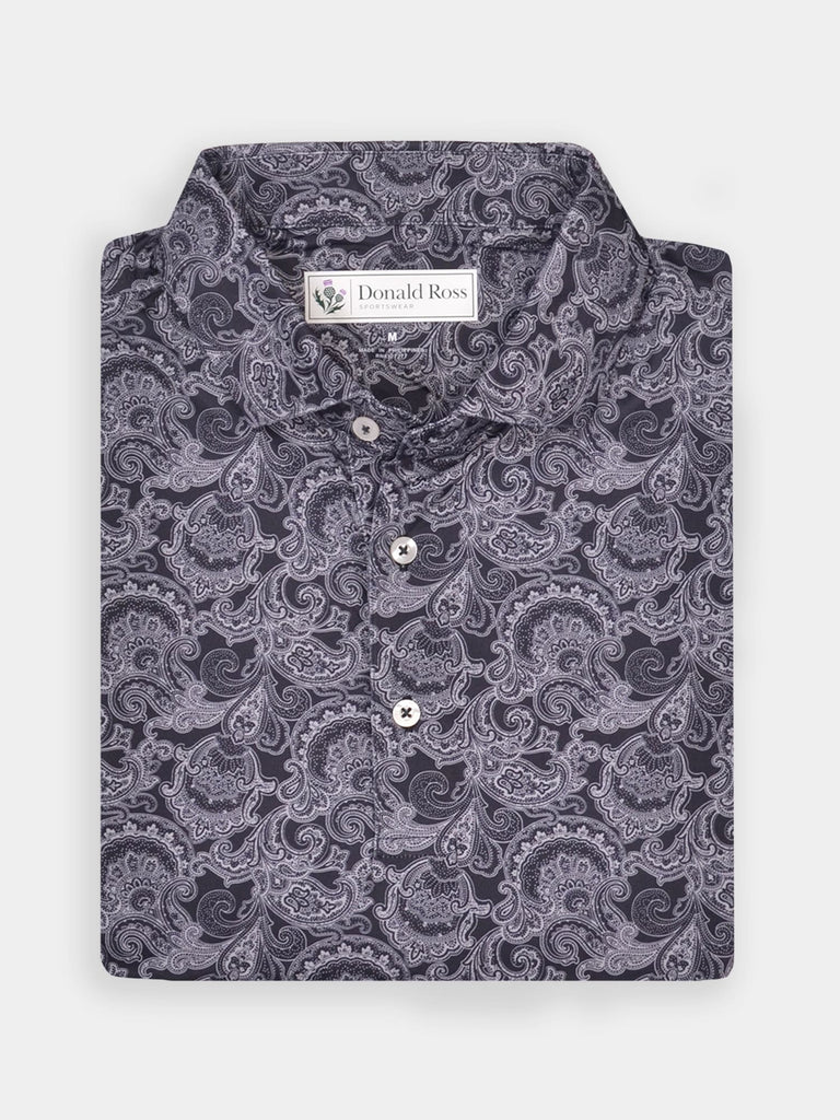 Folded dress shirt with intricate paisley pattern in shades of gray and black, featuring white buttons. The collar is crisp and label visible.