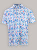 Short-sleeved shirt with a vibrant floral pattern. The design features blue and pink flowers on a white background, creating a playful, summery vibe.