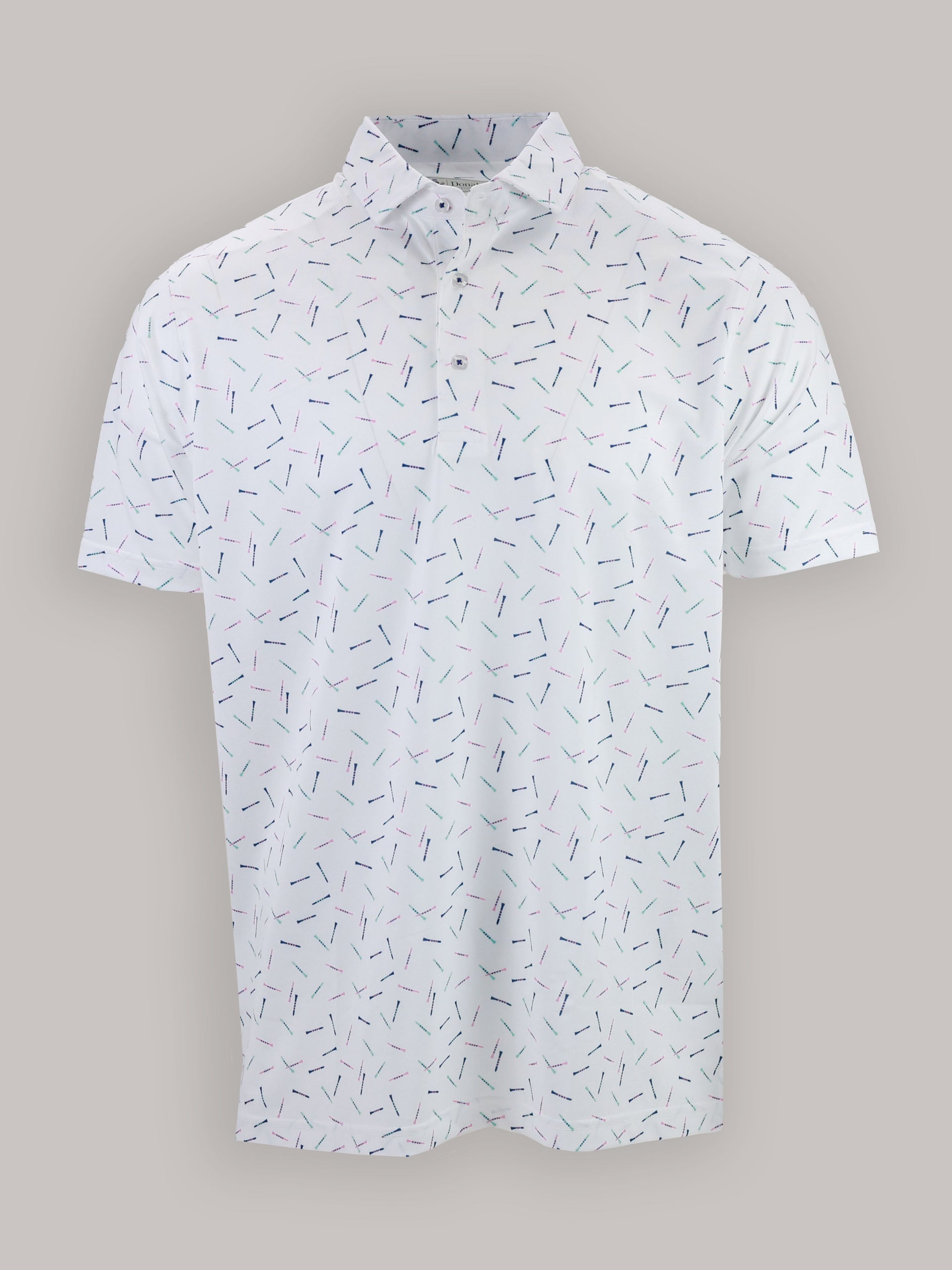A white polo shirt with a subtle abstract pattern of small scattered golf tees in blue, green, and purple. It has a classic collar and short sleeves.