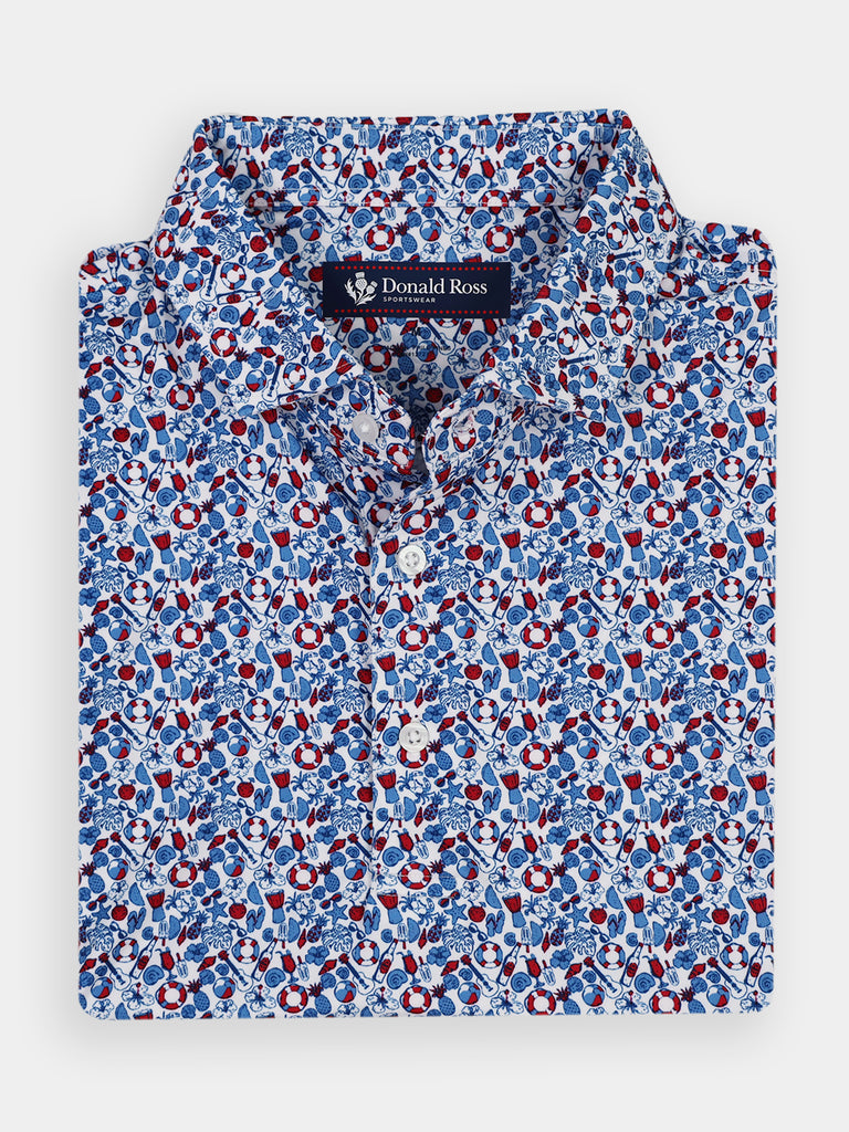 Short-sleeved polo shirt with a vibrant blue, red, and white summery pattern featuring beach party items