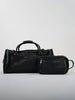 Limited edition black leather duffel bag by Donald Ross featuring premium leather construction, zip-top closure, and matching toiletry bag for luxury travel and golf weekends.