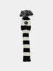 Black and white striped knit hat cover with a pom-pom on top. Features a logo patch at the front.