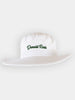A white bucket hat with a floppy 2 1/4 inch brim and the name Donald Ross embroidered in navy blue script on the front crown.