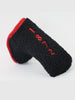 Black wool putter cover with red embroidered details and red binding trim.
