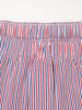 Striped boxer shorts in navy, red, and white vertical stripes featuring an elastic waistband with visible stitching detail.