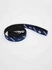 Coiled navy blue dog leash with green and white diagonal stripes, silver clip, and “1872” printed in white