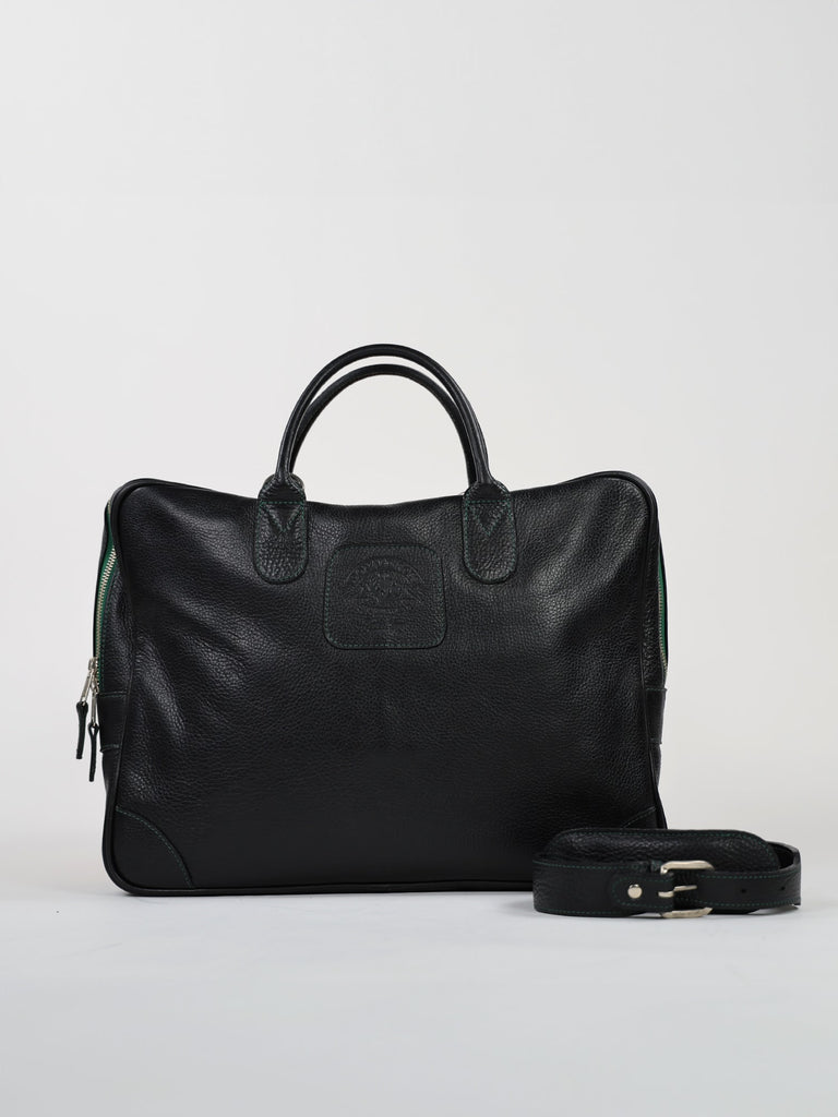 A sleek black leather briefcase with sturdy handle, front logo embossing, and a detachable shoulder strap, exudes a professional and elegant tone
