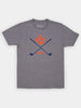 Gray T-shirt featuring blue crossed golf clubs and a red thistle design. The number "1872" is printed in red beneath the clubs, adding a vintage feel.