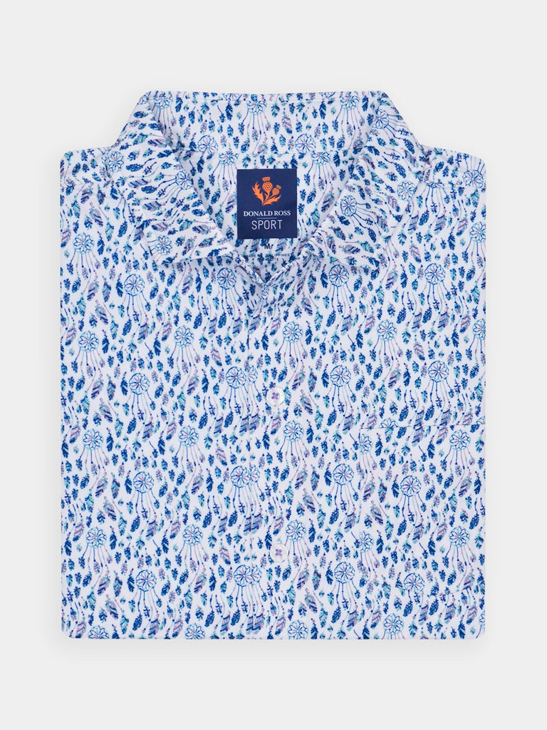 Folded dreamcatcher patterned polo shirt with blue and white designs