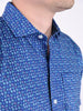 Close-up of a person wearing a blue shirt with colorful zodiac symbols pattern, creating a vibrant and playful mood. The collar is neatly buttoned