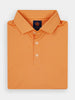 A men's sport fit performance golf polo in red apple red baby pique with a three-button placket and spread collar.