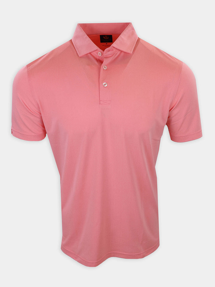A plain pink polo shirt with a collar and short sleeves is displayed against a white background.