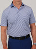 A men's sport fit performance jersey golf polo in denim blue with white feeder stripes and a solid blue collar.