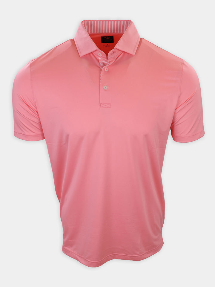 A pink short-sleeved polo shirt is displayed against a plain white background.
