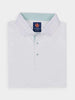 A neatly folded white polo shirt with a classic collar, accented by green-striped detailing inside