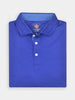 Folded bright blue polo shirt with a collar, white buttons, and a striped inner lining