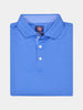 Folded blue polo shirt with a neatly pressed collar and three white buttons