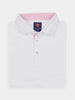 White polo shirt with a buttoned collar on a flat surface. Interior collar features pink stripes and a blue label with an official Donald Ross logo