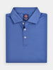 Folded blue polo shirt with a collar and three buttons, made of pemium performance fabrics