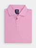 Folded pink golf polo shirt with a structured collar, featuring three white buttons