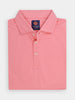 Folded pink golf polo shirt with a collar, featuring three buttons down the center