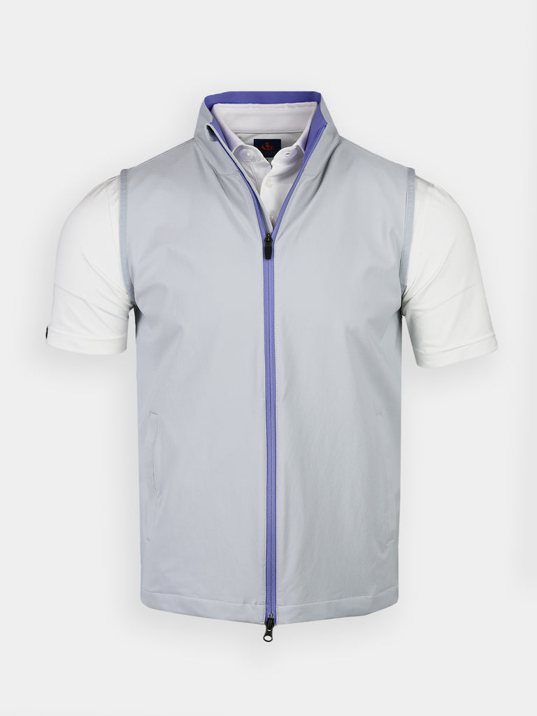 A light gray sleeveless vest with a zip-up front and a slightly raised collar, worn over a crisp white short-sleeve shirt, on a plain background