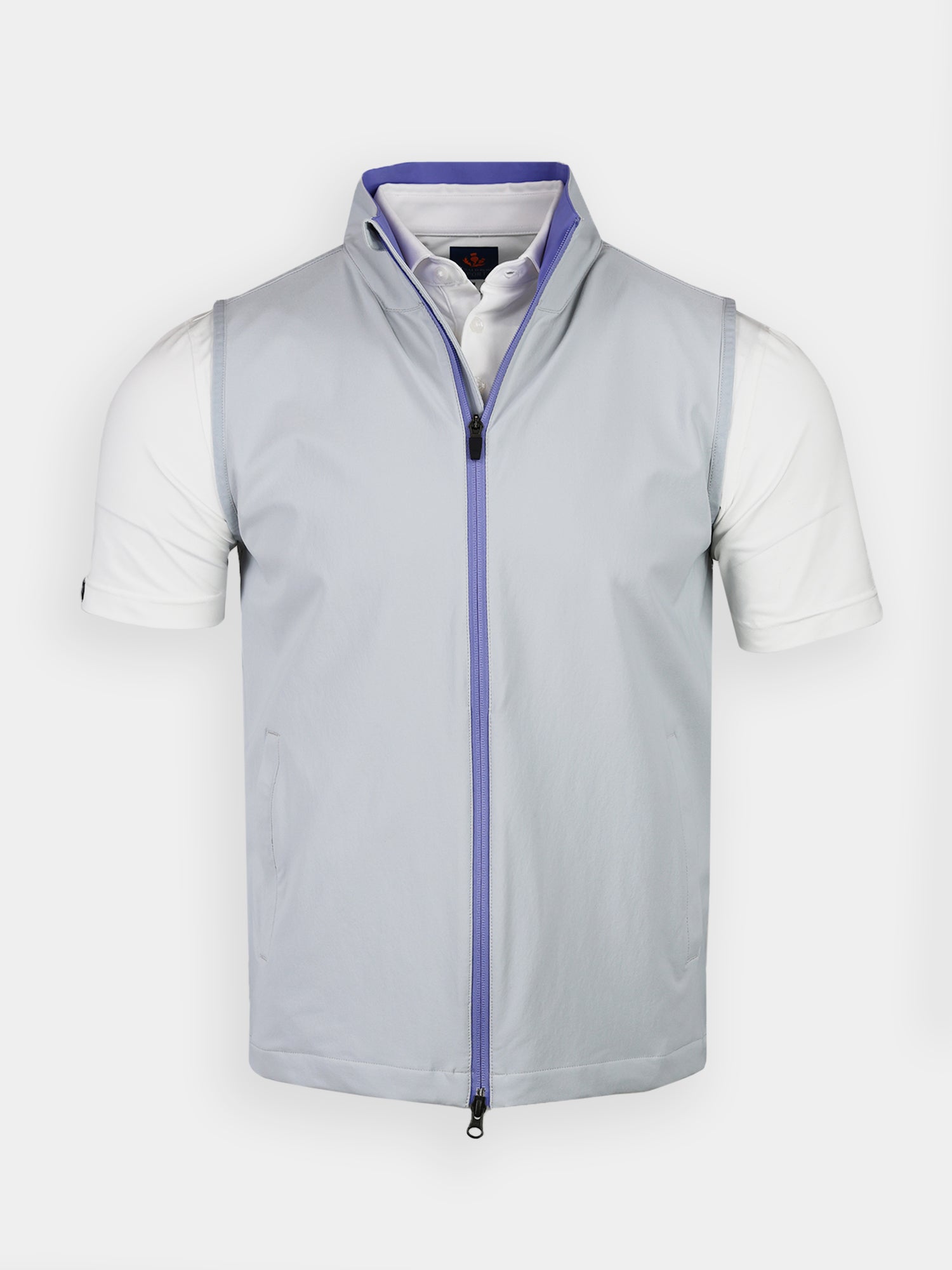 A light gray sleeveless vest with a zip-up front and a slightly raised collar, worn over a crisp white short-sleeve shirt, on a plain background