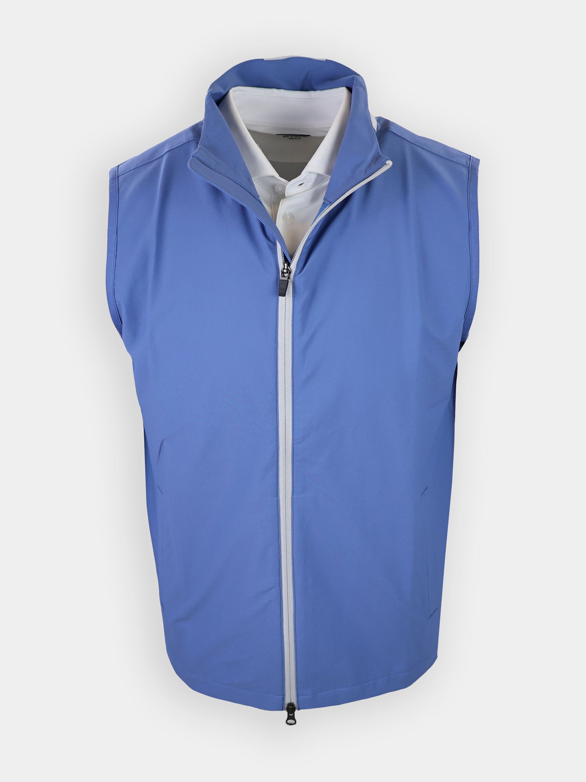 A light blue sleeveless vest is displayed front-facing with a white collared shirt visible underneath.