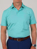 Man wearing a turquoise and white striped polo shirt, dark blue pants, and a brown belt. His watch is visible on his left wrist.