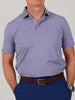 Man in a blue and white striped polo shirt with a brown belt and blue pants. He stands with hands in pockets, conveying a casual and confident demeanor.