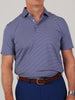 Man wearing a blue and white striped polo shirt with short sleeves, tucked into dark blue pants with a brown belt. The background is plain gray.