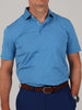 Man wearing a blue and white striped polo shirt, dark blue pants, and a brown belt. The tone is casual and neat, with a neutral background.